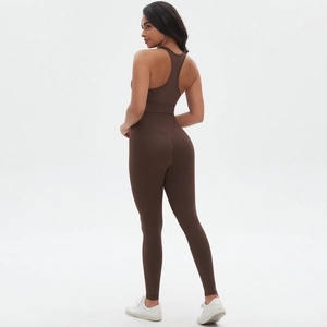 Detail of cross back sports bra and seamless high waist leggings in dark brown gym set