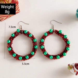 Detailed size view of festive Christmas wreath earrings with red tinsel and green pearls