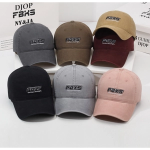 Detailed close-up of washed baseball caps in seven colors with high-quality FBXS embroidery