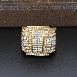 Macro shot of gold-plated hip hop star ring with iced out micro pave zircons