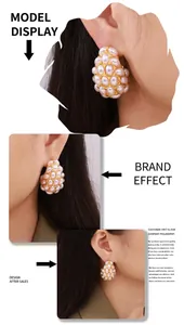 Close-up model display of elegant vintage gold teardrop cluster pearl earrings