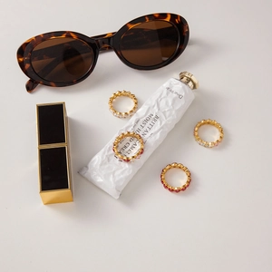 Close-up of luxury gold-plated titanium steel rings with colorful zircon gemstones