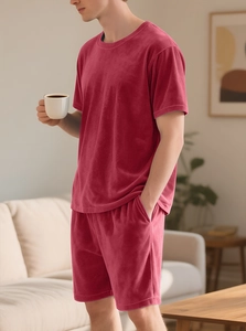 Detail view of burgundy velvet loungewear set featuring soft texture and premium fabric finish