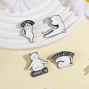 Set of four cute white cat enamel pins in yoga poses on a yellow background