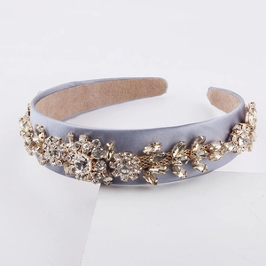 Close-up of Baroque headband with sparkling rhinestones and floral embroidery detail