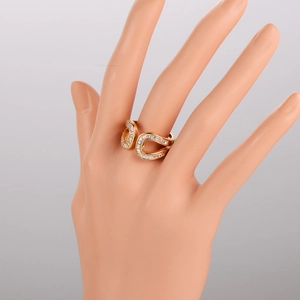 Elegant gold-plated open ring featuring crisscross bands and sparkling cubic zirconia stones