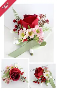 Detailed close-up of dark red rose boutonniere with berries and green fern accents