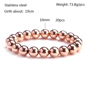 Detailed view of 10mm rose gold stainless steel beads on a polished elastic bracelet