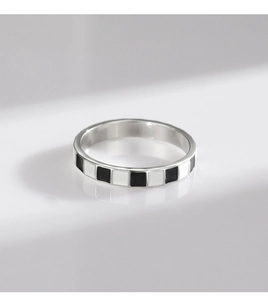 Detailed view of S925 silver ring featuring classic black and white checkerboard enamel