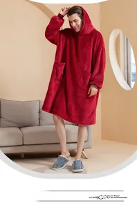 Detail of burgundy wearable blanket with large side pockets and ribbed cuffs