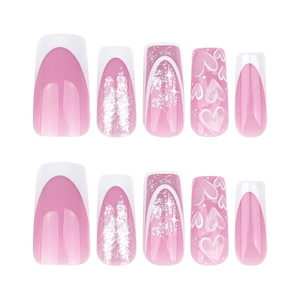 Pink gradient French press-on nails with silver glitter, white hearts and star motifs