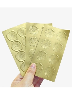 Detail showing gold wax seal stickers with embossed Best Quality and floral patterns