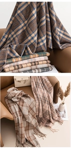 Close-up of soft plaid scarves with fringe details in brown, blue and beige tones