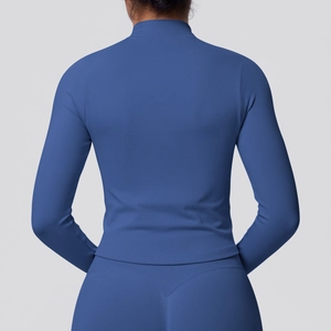Detail of blue seamless yoga jacket with high-elastic ribbed texture and vertical grain
