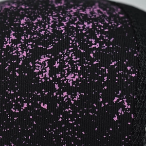 Macro detail of black fabric with purple starry glitter texture on a baseball cap