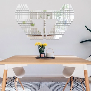 Creative wing-shaped wall decor made of 100 square acrylic mirror tiles in a dining room