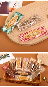 Macro detail of assorted nut crisps in various heat-sealed transparent wrappers on a tray
