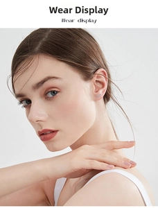 Close-up of elegant S925 sterling silver pea stud earrings worn on female model's ear