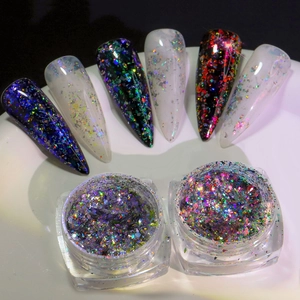 Macro view of holographic nail glitter powder jars and almond shape nail art samples