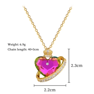 Detail showing dimensions of heart crown necklace with pink green gradient crystal