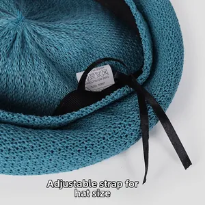 Detailed close-up showing the adjustable drawstring inside a blue knitted linen beret