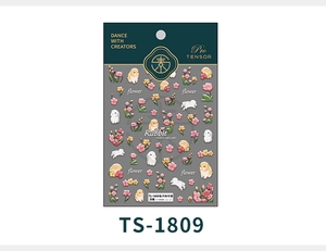 Detail of 5D embossed nail stickers featuring white rabbits and floral motifs on green card