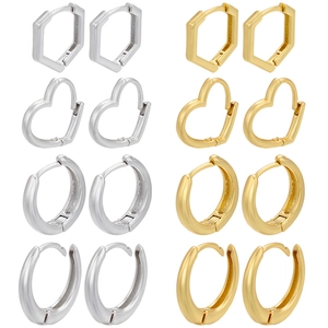 Set of geometric hoop earrings in gold and silver finish featuring heart and hex shapes