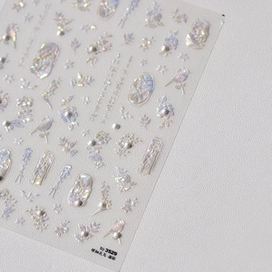 Holographic 3D embossed nail stickers featuring birds and flowers with pearl accents