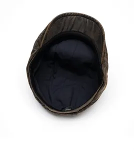 Detailed interior view of vintage brown cotton beret featuring high-quality lining