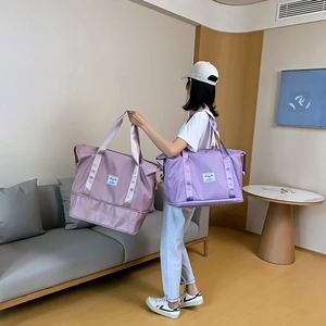 Large capacity foldable travel duffle bag for gym and weekend trips in purple colors