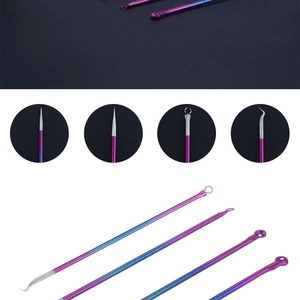 Detail view of 4-piece stainless steel blackhead remover tool set in purple-blue gradient