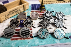 Detail of steampunk flip-up sunglasses with hollowed-out pattern metal frames and gear texture