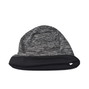 Detail of grey marl knitted beanie with black cuffed edge and white side label