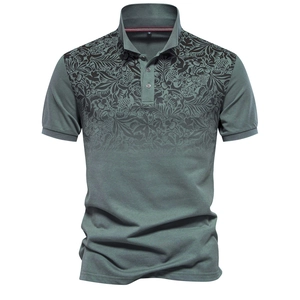 Close-up of green-grey cotton polo shirt featuring delicate black plant print texture