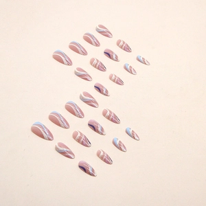 Almond-shaped press-on nails featuring blue wave patterns and silver glitter accents