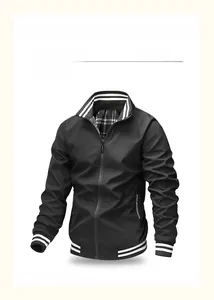 Detail of black sports jacket featuring black and white striped ribbed cuffs and collar