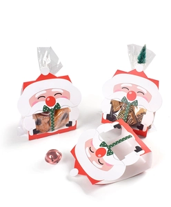 Détail de la boîte cadeau Père Noël avec fenêtre transparente et nœud vert festif