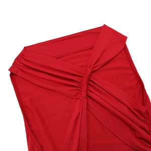 Detail shot of the twisted knot design and ruched texture on a red backless long dress