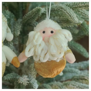 Close-up of plush Christmas elf ornament with cream faux fur and golden metallic base