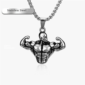 Macro detail of stainless steel muscular man pendant with realistic carved physique