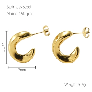 Detail of 18k gold plated stainless steel C-hoop earrings with 22mm x 17mm dimensions