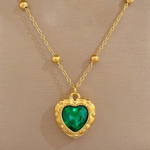 Minimalist titanium steel necklace with green heart pendant and gold bead chain