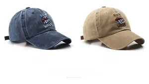 Flat lay of navy and khaki washed cotton baseball caps with SURF WAVE embroidery details