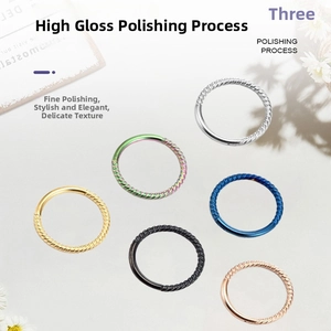 Detail view of 6-piece twisted and smooth stainless steel hoop earrings in various colors