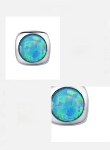 Detailed view of square opal earrings in S925 sterling silver with blue-green fire effect