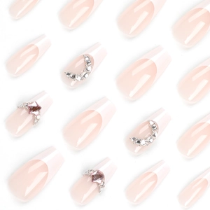 Nude pink French coffin press-on nails with sparkling rhinestones and moon accents