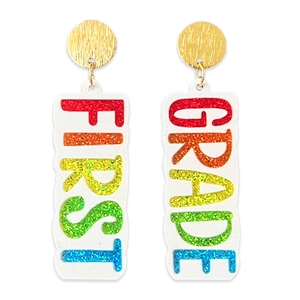 Detailed shot of gold stud earrings with rainbow glitter FIRST GRADE school pendants