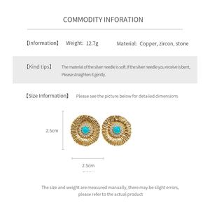 Detailed view of 12.7g sunflower earrings with blue stone and white zircons