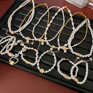 18k gold plated pearl necklace set with irregular square gemstones in a luxury fashion style
