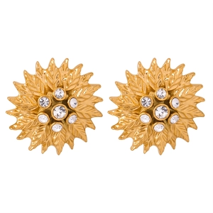Golden sunburst leaf earrings with sparkling zircon crystals on white background